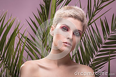 Portrait of blonde girl with artistic makeup. Stock Photo