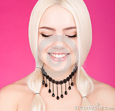 Closeup beauty portrait of young beautiful woman with a charming smile and closed eyes Stock Photo