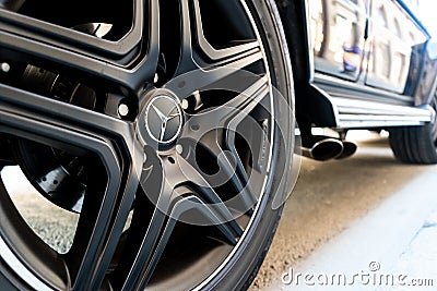 Closeup of a black car tire with a Mercedes-Benz star. German car manufacturer of luxury cars. Editorial Stock Photo
