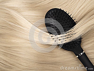 Black hair brush and blond hair. Stock Photo