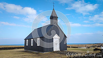 Closeup of a black Hellnar Church under the blue sky in Iceland Stock Photo