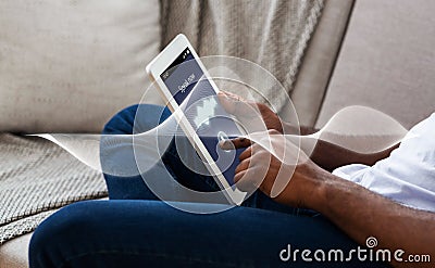 Closeup of black man testing sound on digital tablet Stock Photo