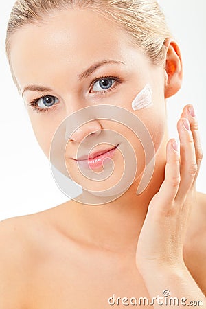 Closeup blond woman portrait with cream Stock Photo