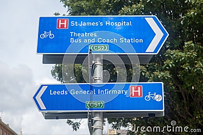 Closeup of blue directional road signs for cyclists to cycle different superhighways in Leeds Editorial Stock Photo