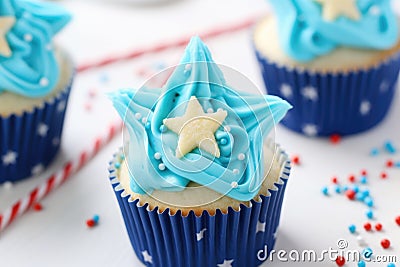 closeup of a blue icing cupcake with star sprinkles Stock Photo
