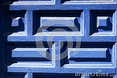 Closeup of blue painted wooden entrance door. Part of renovated door with pattern Stock Photo