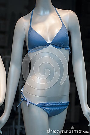 blue stripped bikini on mannequin in fashion store showroom for women Stock Photo