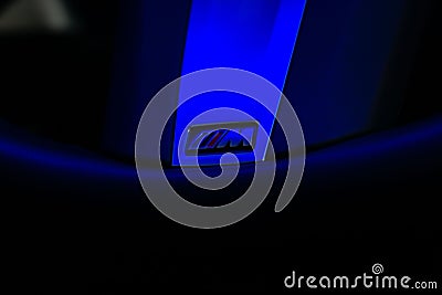 Closeup of BMW M sport steering wheel badge under blue light Editorial Stock Photo