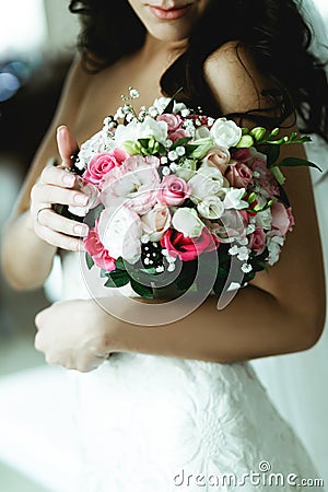 A closeup of a bouquet in tender bride`s hands Stock Photo