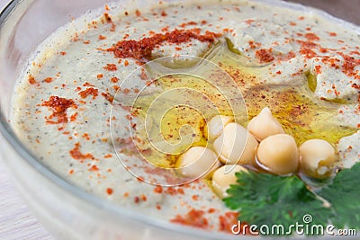 Closeup of A bowl of creamy hummus with olive oil. Stock Photo