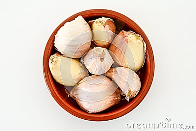 Closeup of a bowl of pink garlic cloves Stock Photo