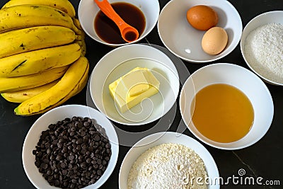 Closeup of bowls of baking ingredients for balking banana and chocolate cake Stock Photo