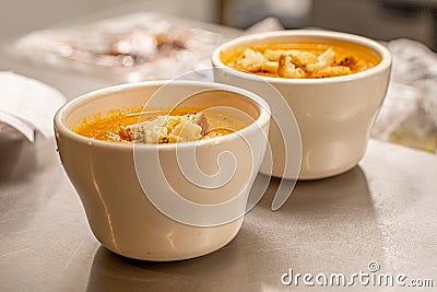 Closeup of a bowls of fresh and tasty tomato soup with bread Stock Photo