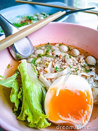 Closeup Bowls of Spicy Fish Noodle Soup with Fish Balls Stock Photo