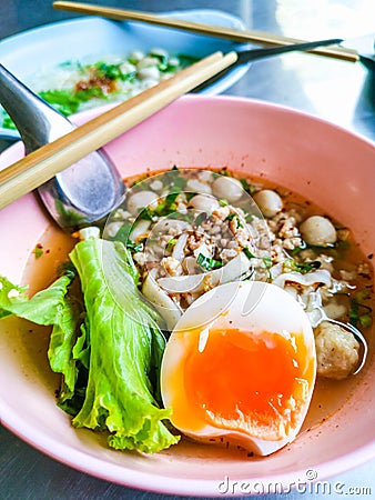 Closeup Bowls of Spicy Fish Noodle Soup with Fish Balls Stock Photo