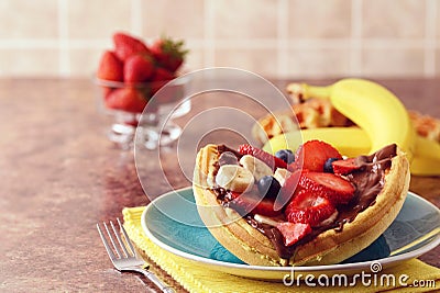 Closeup breakfast waffle fruit sandwich with chocolate spread Stock Photo