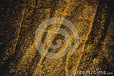 Closeup of a bright sequins scattered black table Stock Photo