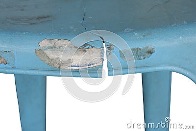 Closeup broken blue plastic chair isolated on white background. Stock Photo
