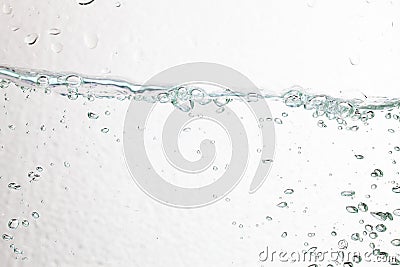 Closeup bubbles underwater on white background. Stock Photo