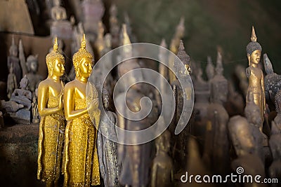 Closeup of Buddha statues at the Pak Ou Caves Stock Photo