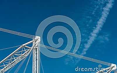 Closeup building crane against blue sky and clouds Stock Photo