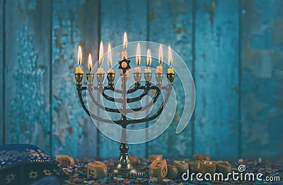 Closeup of a burning Chanukah candlestick with candles Menorah Stock Photo