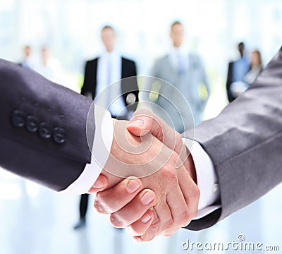 Closeup of a business handshake. Business people shaking hands Stock Photo