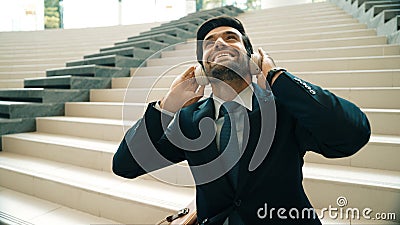 Closeup of business man enjoy to listen music by using headphone. Exultant. Stock Photo