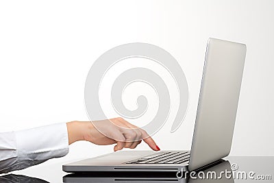 Closeup of business woman hand typing on laptop keyboard Stock Photo