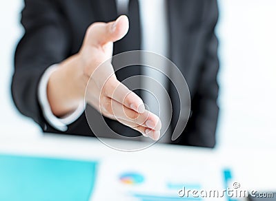 Closeup businessman hand reaching out for a handshake Stock Photo