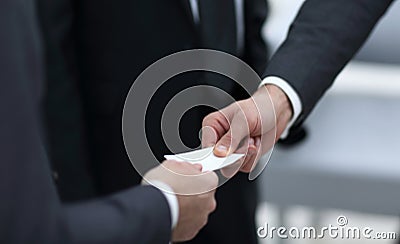 Businessman handing business card to the partner. Stock Photo