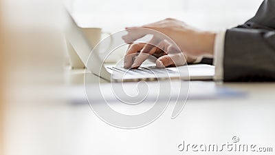 Closeup of businessman hands using laptop computer Stock Photo