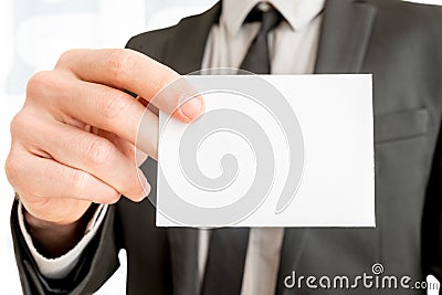 Closeup of businessman showing blank white business card Stock Photo