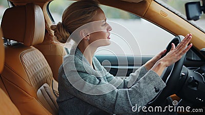 Closeup businesswoman punching steering wheel. Sad girl standing in traffic jam Stock Photo
