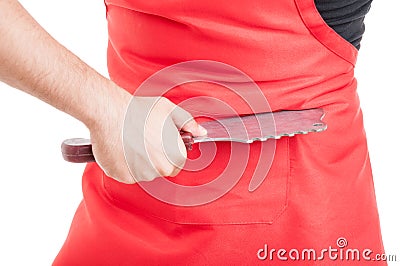Closeup of butcher hand stabbing tummy Stock Photo