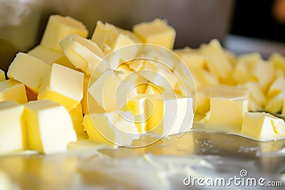 closeup of butter cubes being weighed for sale Stock Photo