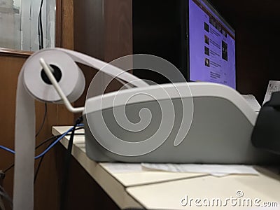 Closeup of a calculator at foreground with computer monitor on the background Stock Photo