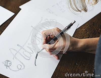 Closeup of a calligrapher working on a project Stock Photo