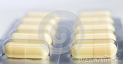 Closeup capsules and pills packed in blisters on white Stock Photo