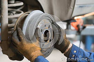 Closeup of car mechanic repairing brake pads Stock Photo