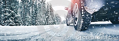 Closeup of car tires in winter on the road Stock Photo