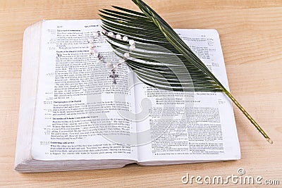 Closeup Catholic rosary with crucifix and beads on bible Stock Photo