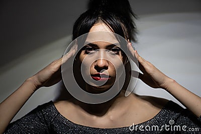 Closeup of a Caucasian female with a serious facial expression - a fierce woman Stock Photo