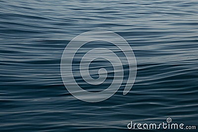 Calm deep blue water with ripples background wallpaper Stock Photo