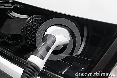 Closeup charger battery for electric car. Electric vehicle is pl Stock Photo