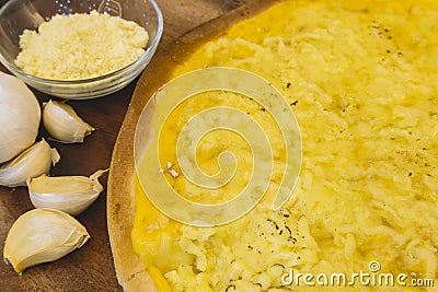 Closeup of cheesy garlic pizza with separate ingredients Stock Photo