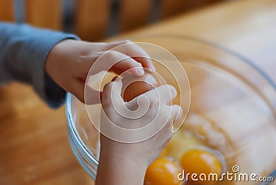 Closeup, of a child breakable egg on the kitchen table in a glass Stock Photo