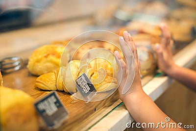 Closeup of child's hands on glass wanting to Stock Photo