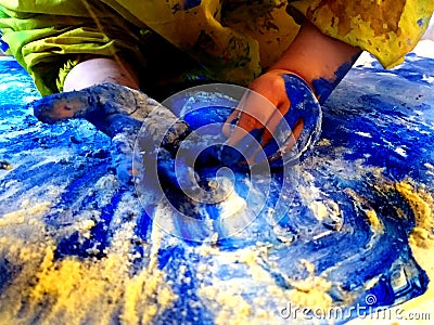 Closeup of children hands painting during a school activity - learning by doing, education and art, art therapy concept Stock Photo