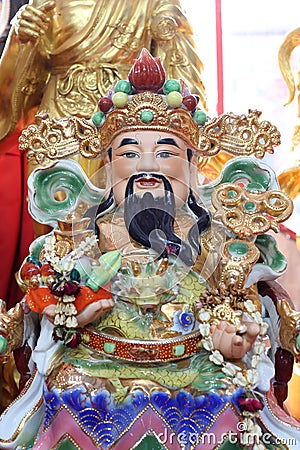 Closeup Chinese god statue. Stock Photo